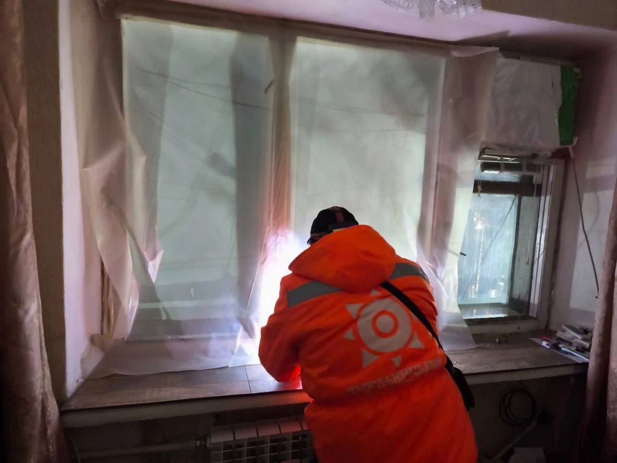 Utility worker dealing with the aftermath of the Russian attack