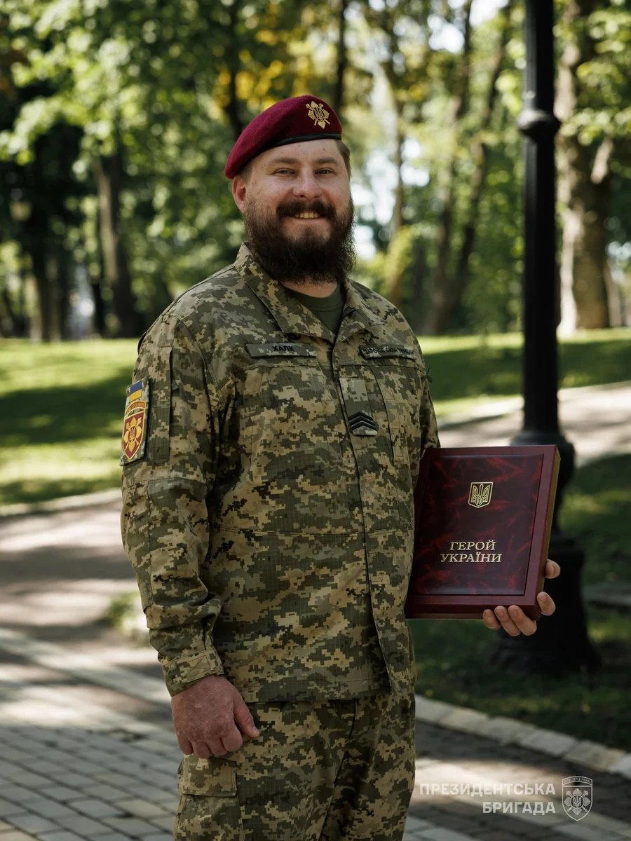 Roman holding the Order of the Gold Star