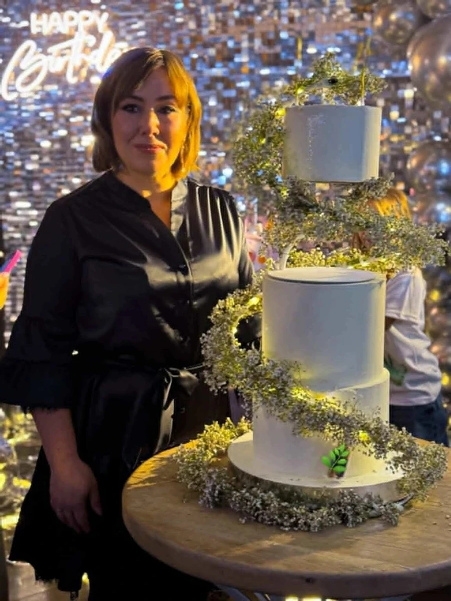 Liudmyla and a cake she baked herself