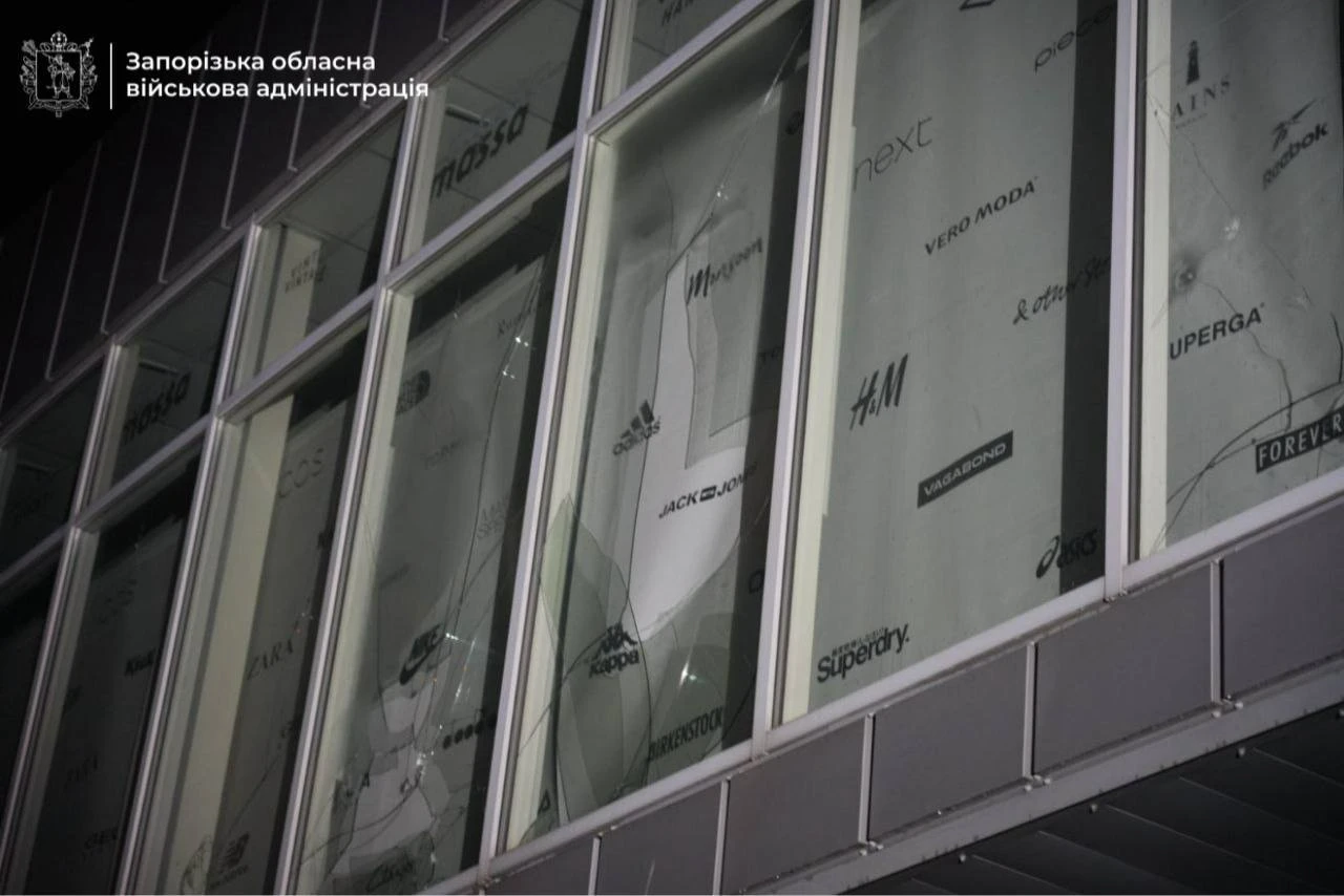 Cracked panes in a shopping centre's glass front.