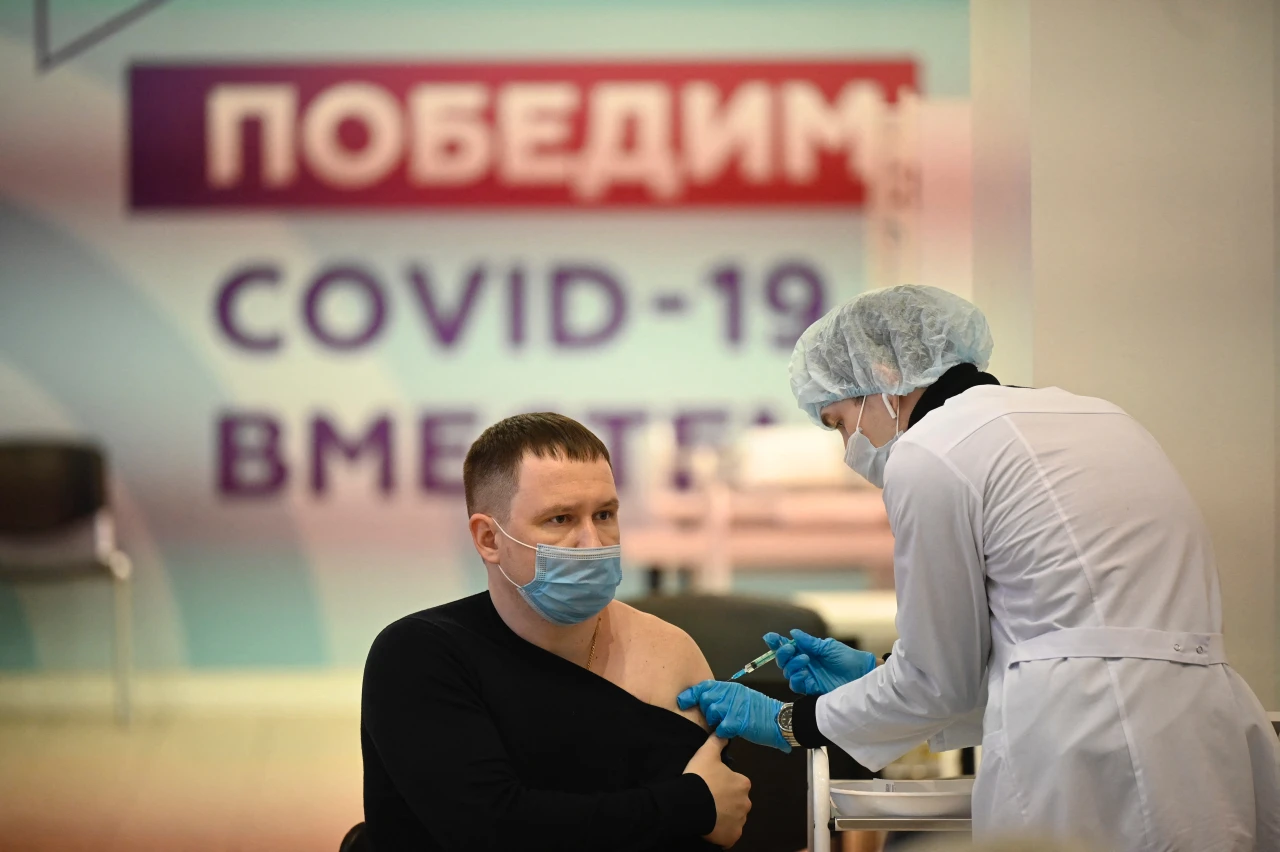 A man receiving Sputnik V vaccine.