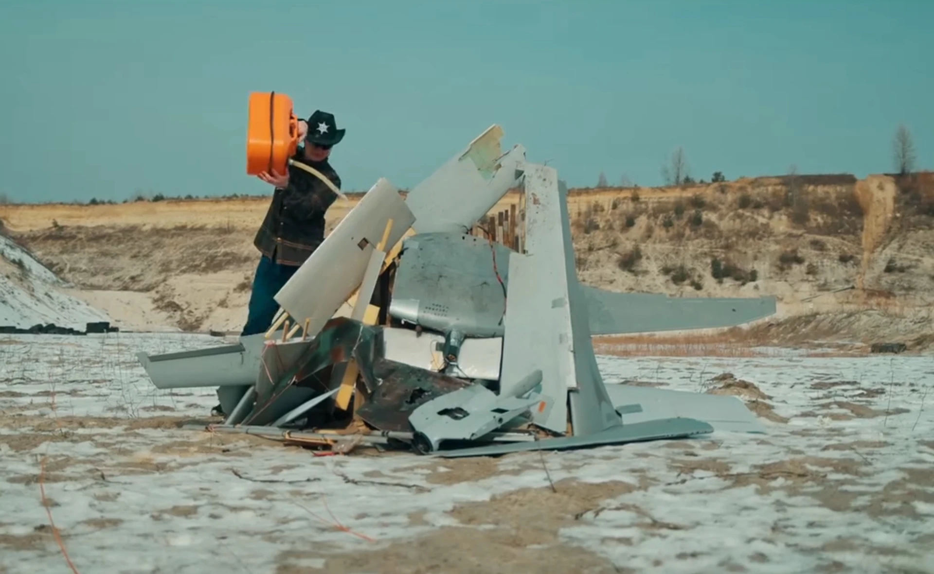 Taras Chmut, head of the Come Back Alive Foundation, burning Russian Supercam and Zala drones on camera to promote the Dronefall project